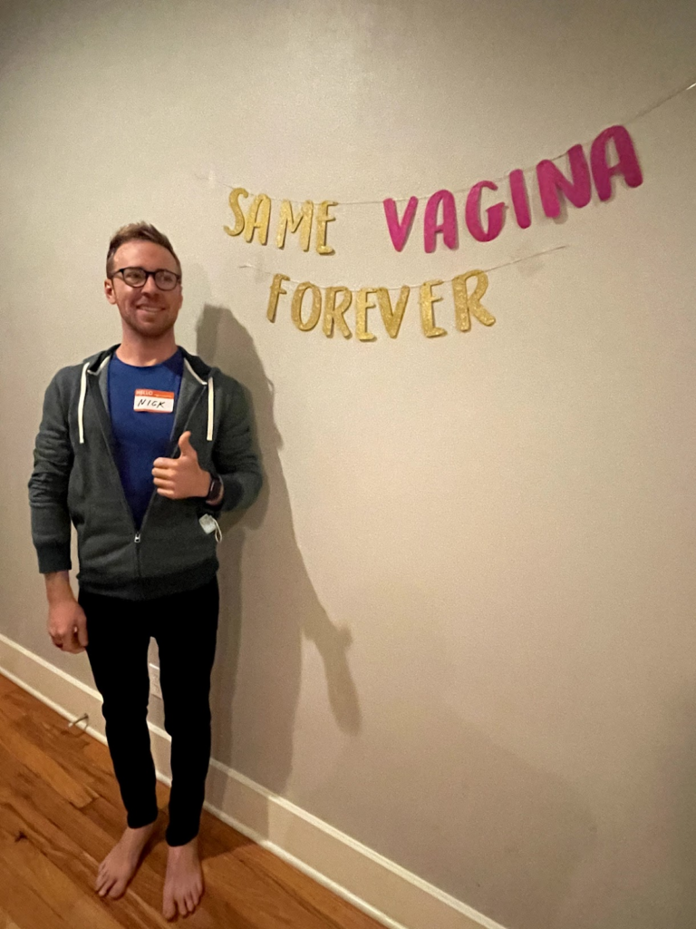 Nick in an awkward pose ( I guess its because of the signage )